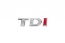 Volkswagen Caddy 2010–2015 Napis TDI (poševna pisava) V celoti kromirano fotografija 1