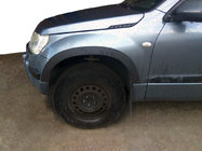 Suzuki Grand Vitara 2005–2017 Obrobe kolotekov (4 kosi, črne) fotografija 1