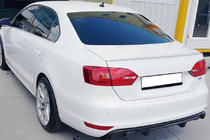 Volkswagen Jetta 2011–2018 OEM spojler (za barvanje) fotografija 1