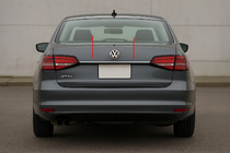 Volkswagen Jetta 2011–2018 Letvica nad registrsko tablico (Carmos, nerjaveče jeklo) fotografija 1