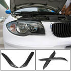 BMW serija 1 E81/E82/E87/E88 2004–2011 Trepalnice za žaromete (karbon) fotografija 1
