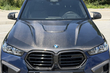BMW X5 G05 2018 → X5M 2025: celovita prenova s karbonskim bodykitom in M-volanom fotografija 10