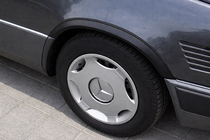 Mercedes E-class W124 1984–1997 Obrobe kolotekov 1989-1995 (4 kosi, črne, ABS plastika) fotografija 1