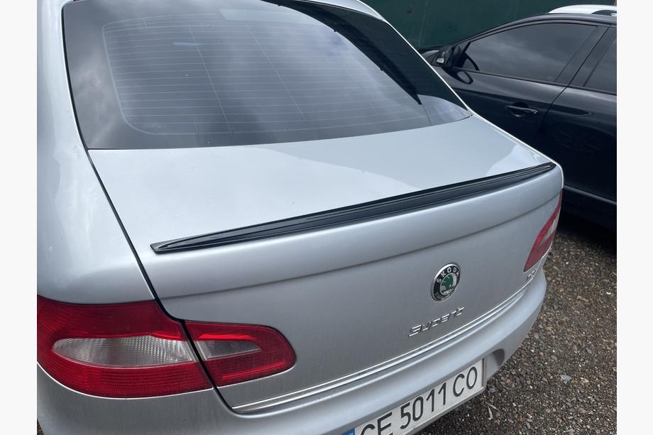 Skoda Superb 2009–2015 LIP spojler (Sunplex, črn) (115,8 cm x 6,3 cm) Image